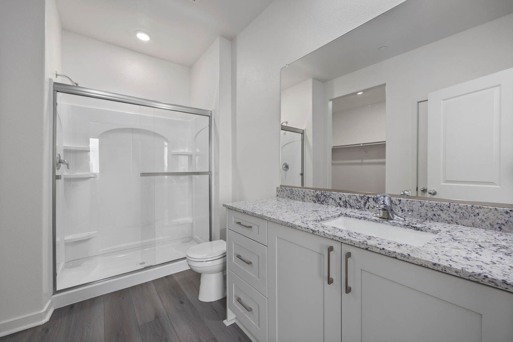 The master bathroom has a large vanity.