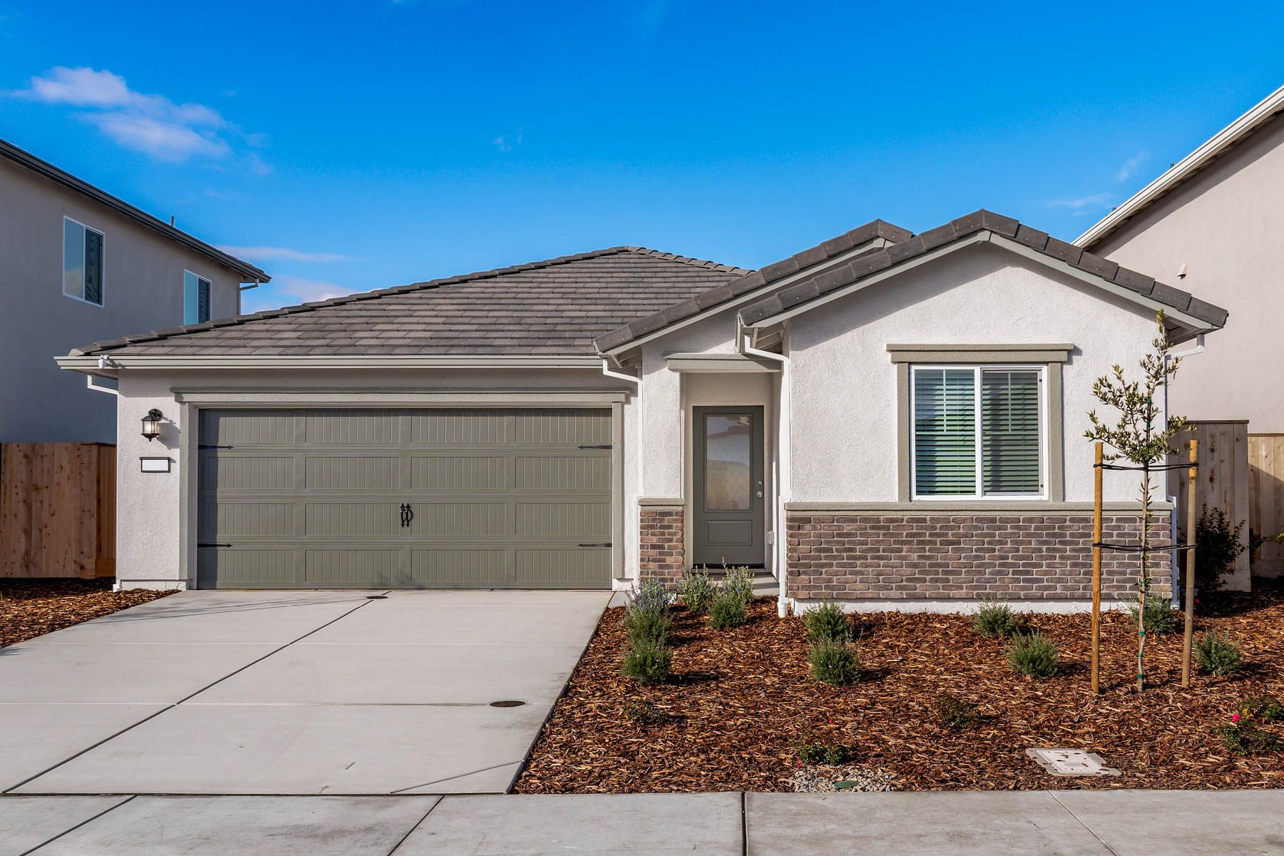 The Blazer is a beautiful three bedroom home with stucco.