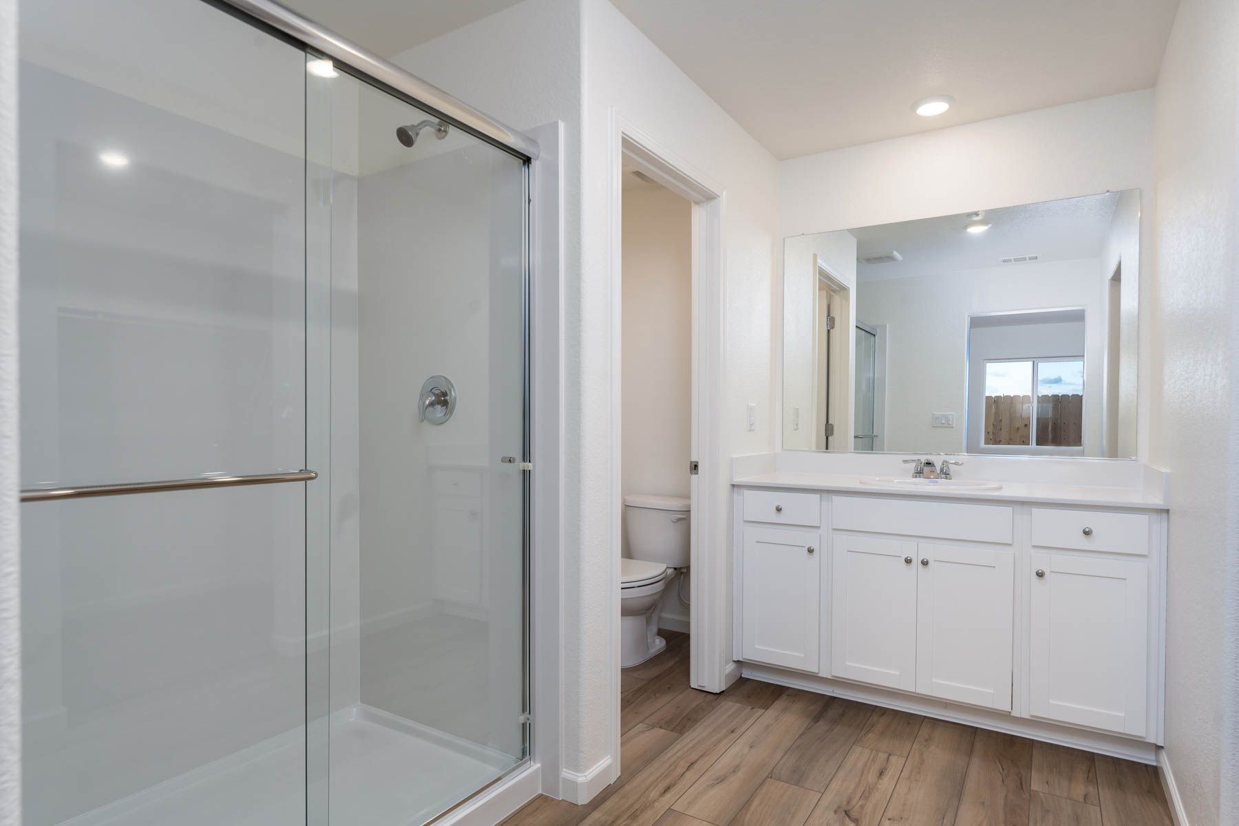 The master bathroom has a dual sink vanity.