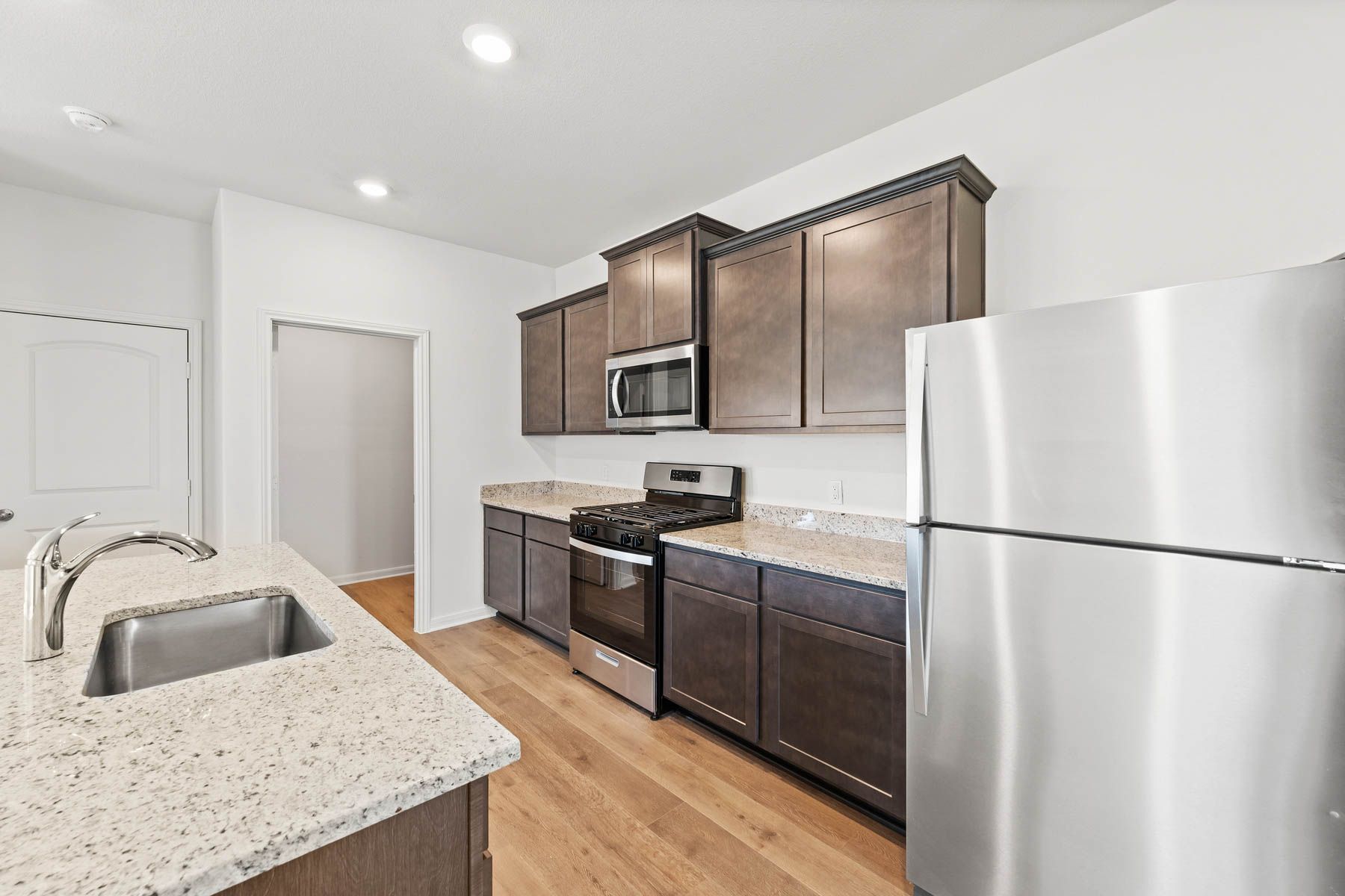 The kitchen of the Camelia has a gorgeous wood cabinetry.