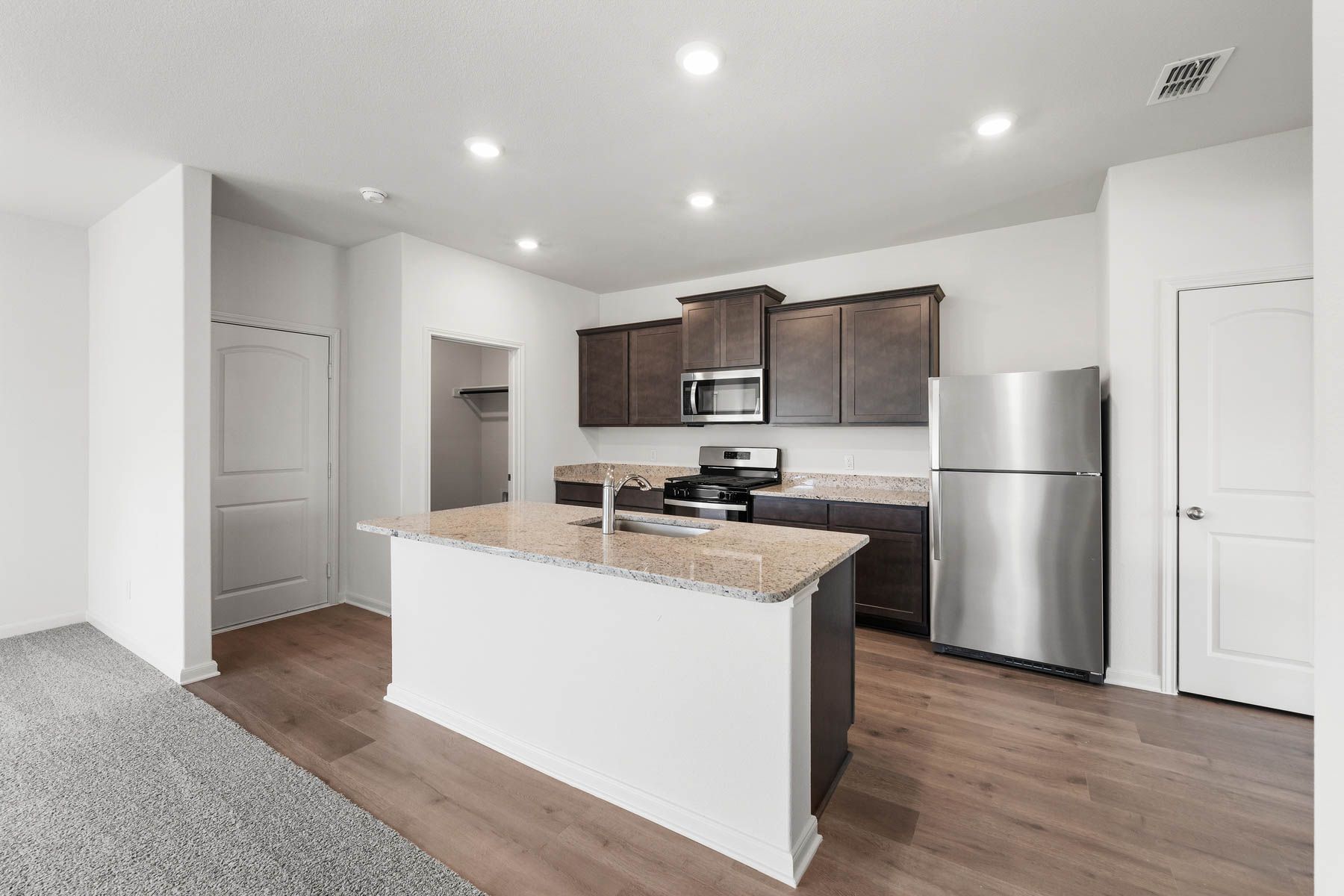 The kitchen of the Camelia has beautiful granite countertops.