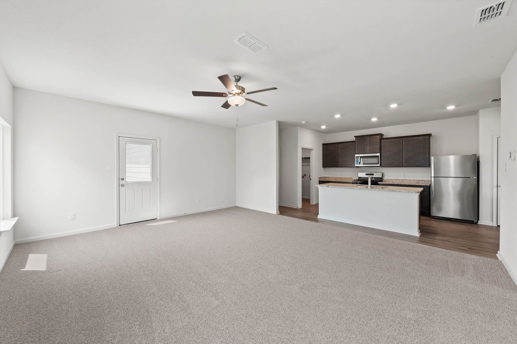 The family room is spacious and has plenty of space for furniture.