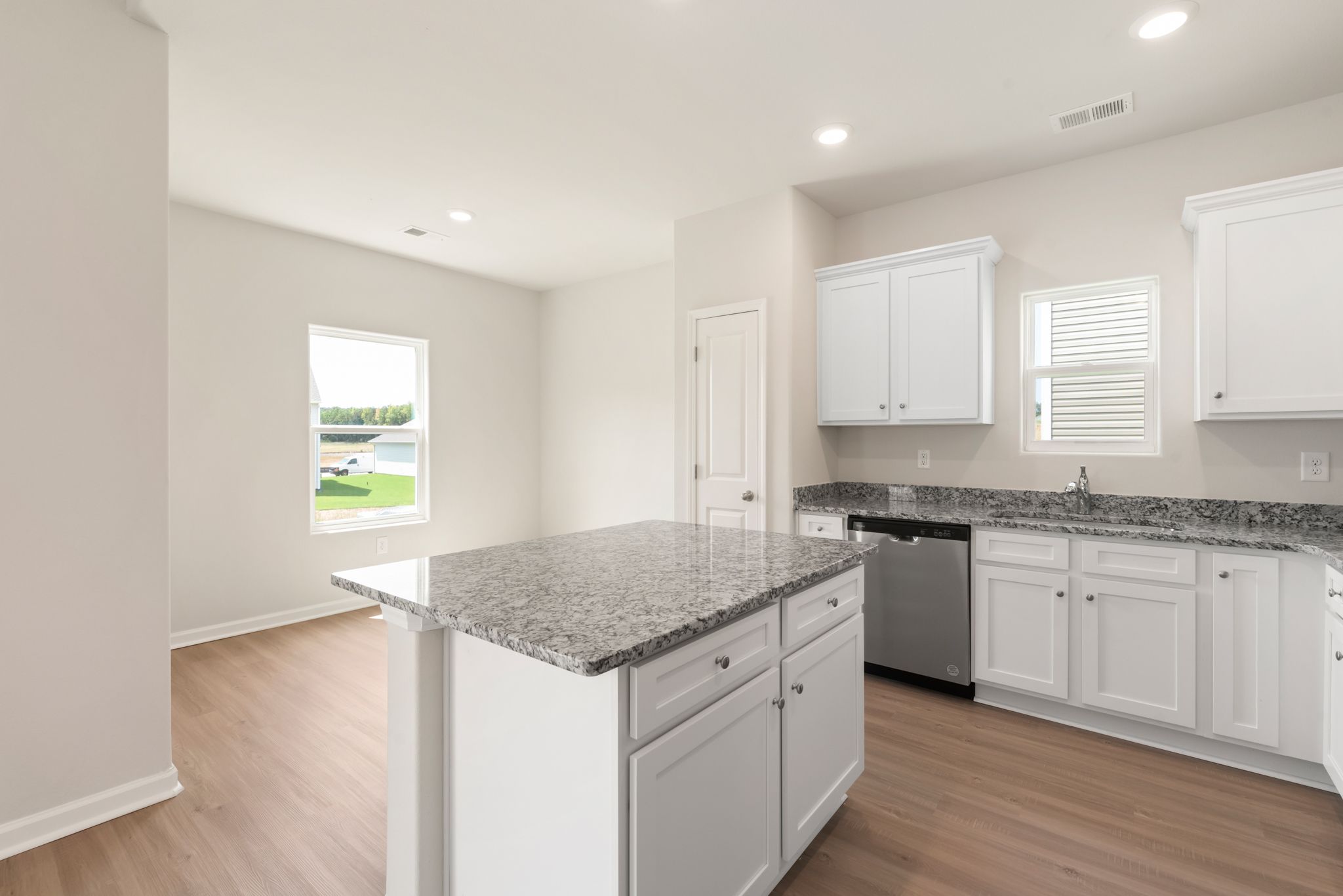 The kitchen opens up to the dining room