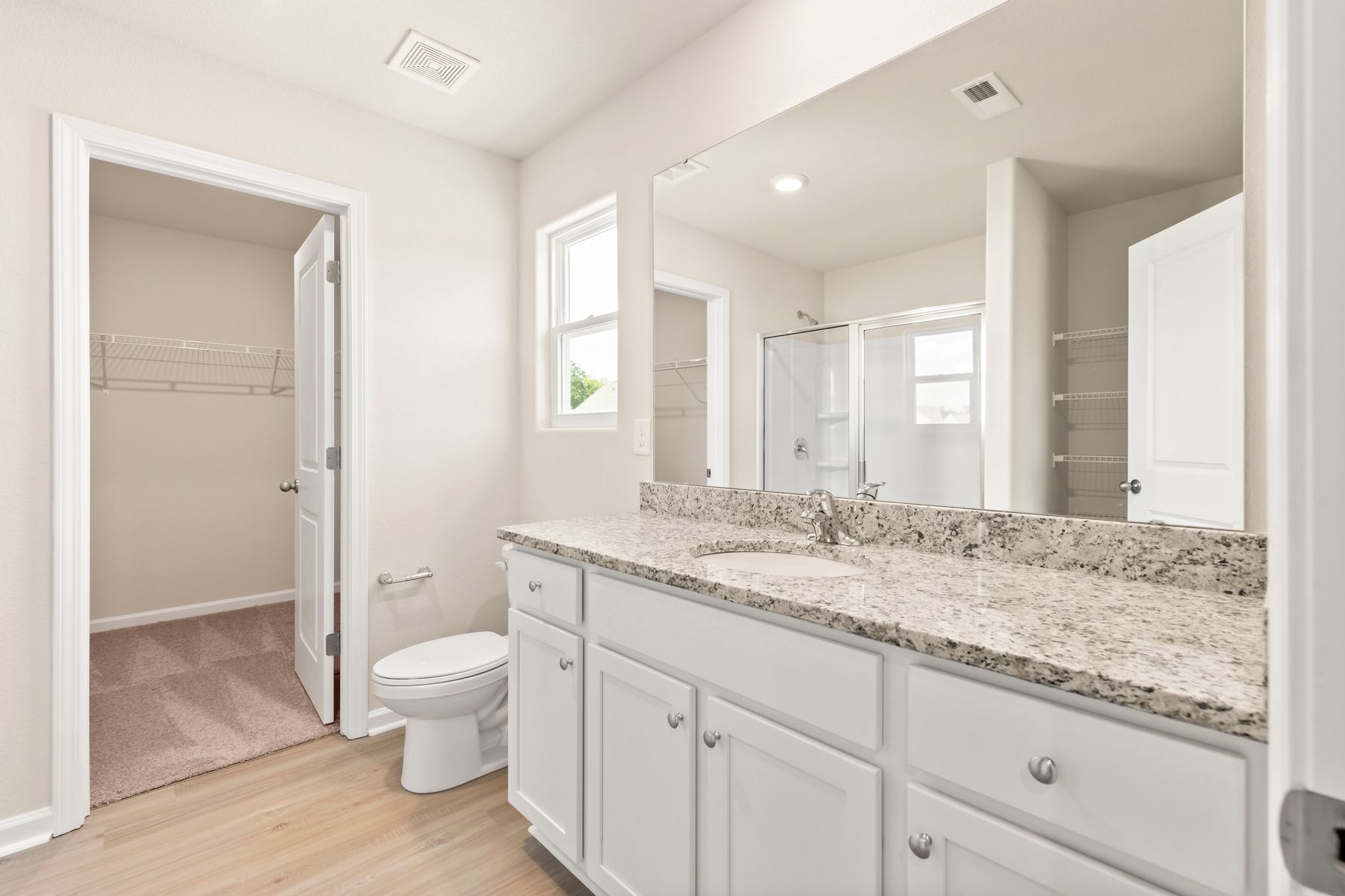 This bathroom has granite countertops