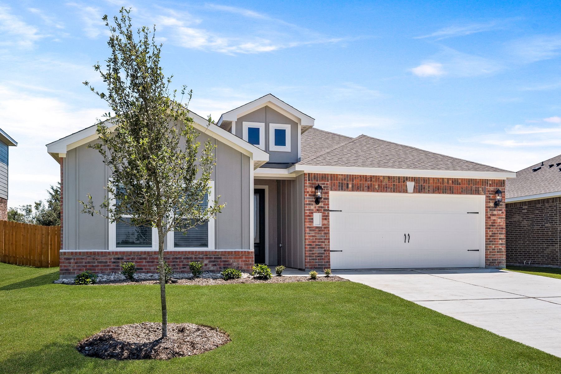 The one-story Sabine floor plan has a siding and brick exterior.