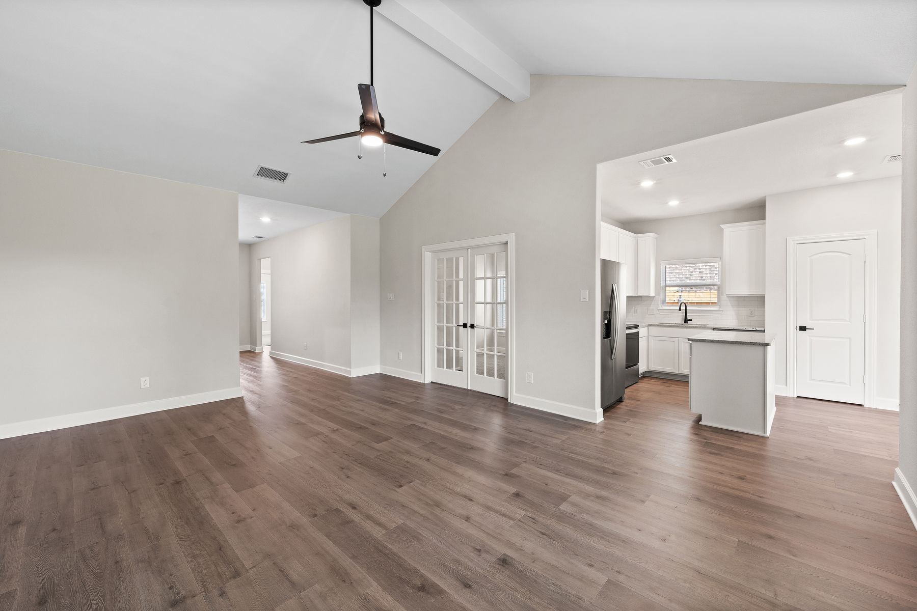 The family of the Sabine floor plan sits right off of the kitchen.