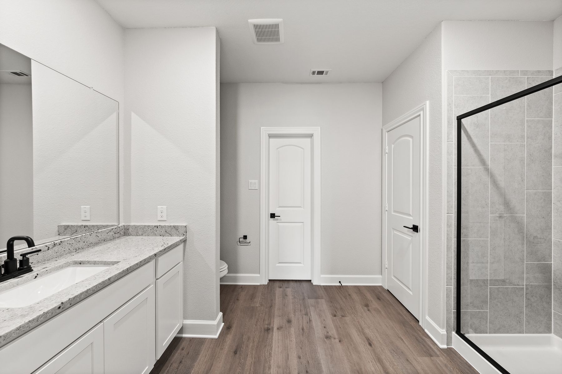 The master bathroom of the Sabine floor plan has a glass, walk-in shower.