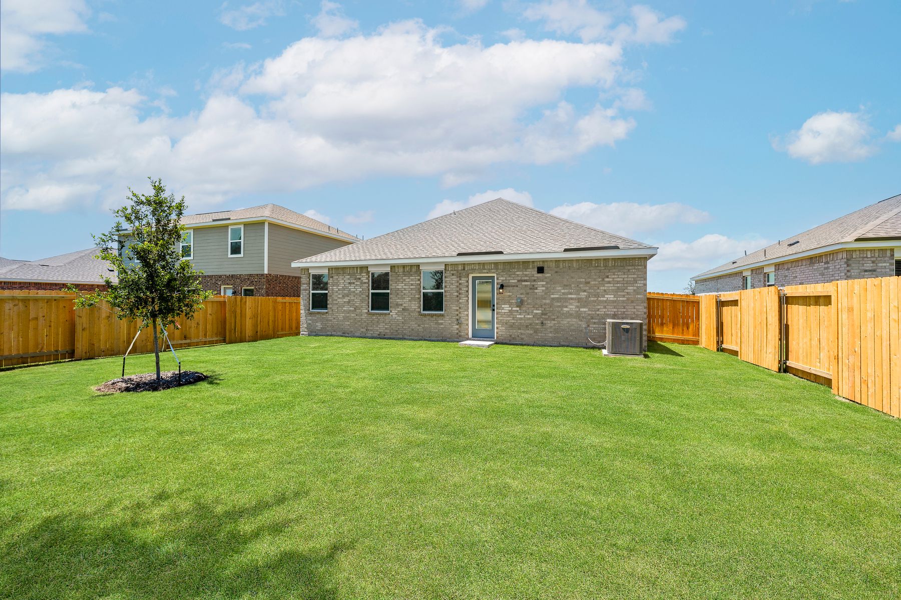 The back yard of the Reed has a large fenced-in back yard.