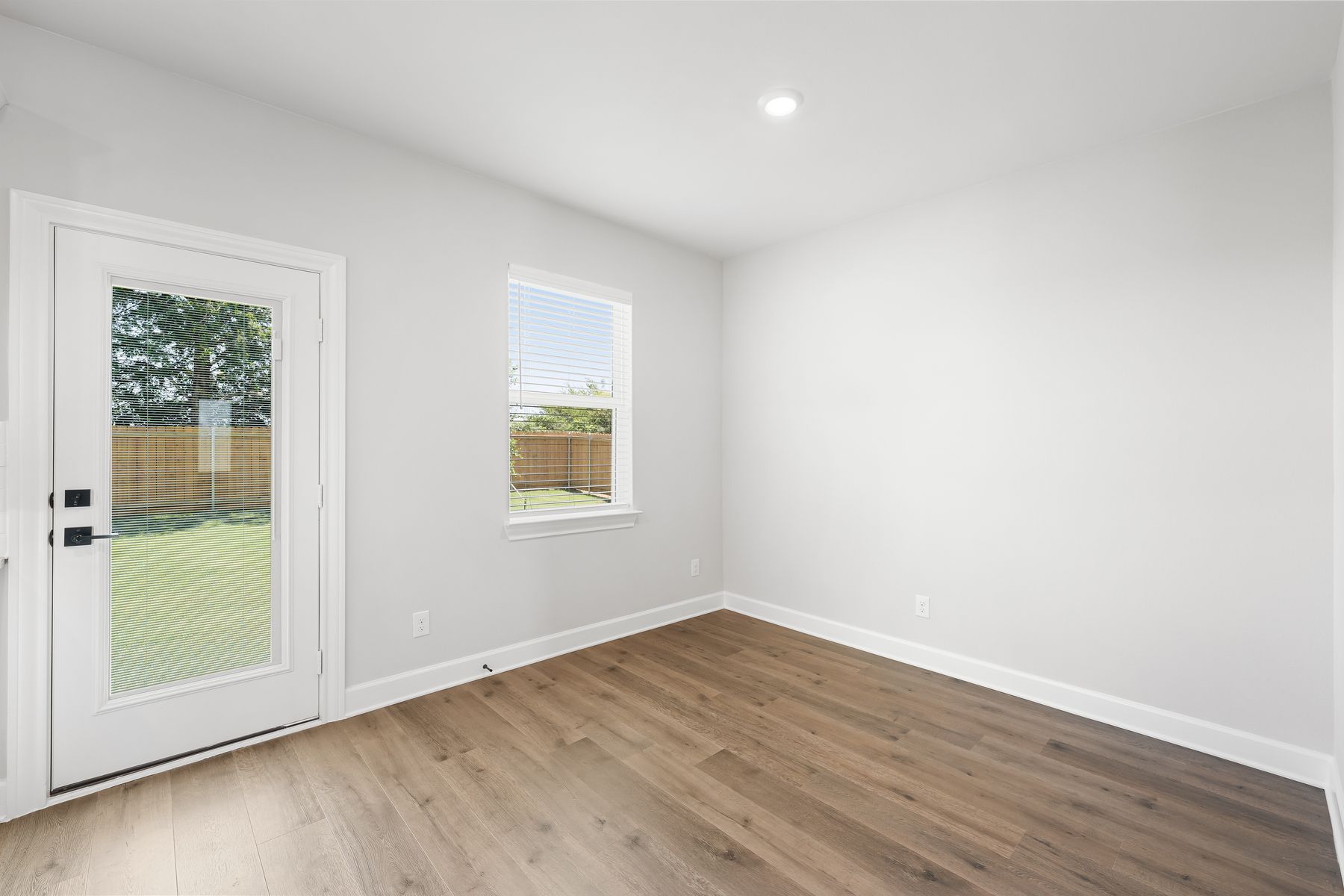 The dining room of the Reed floor plan has a large window that lets in great, natural light.