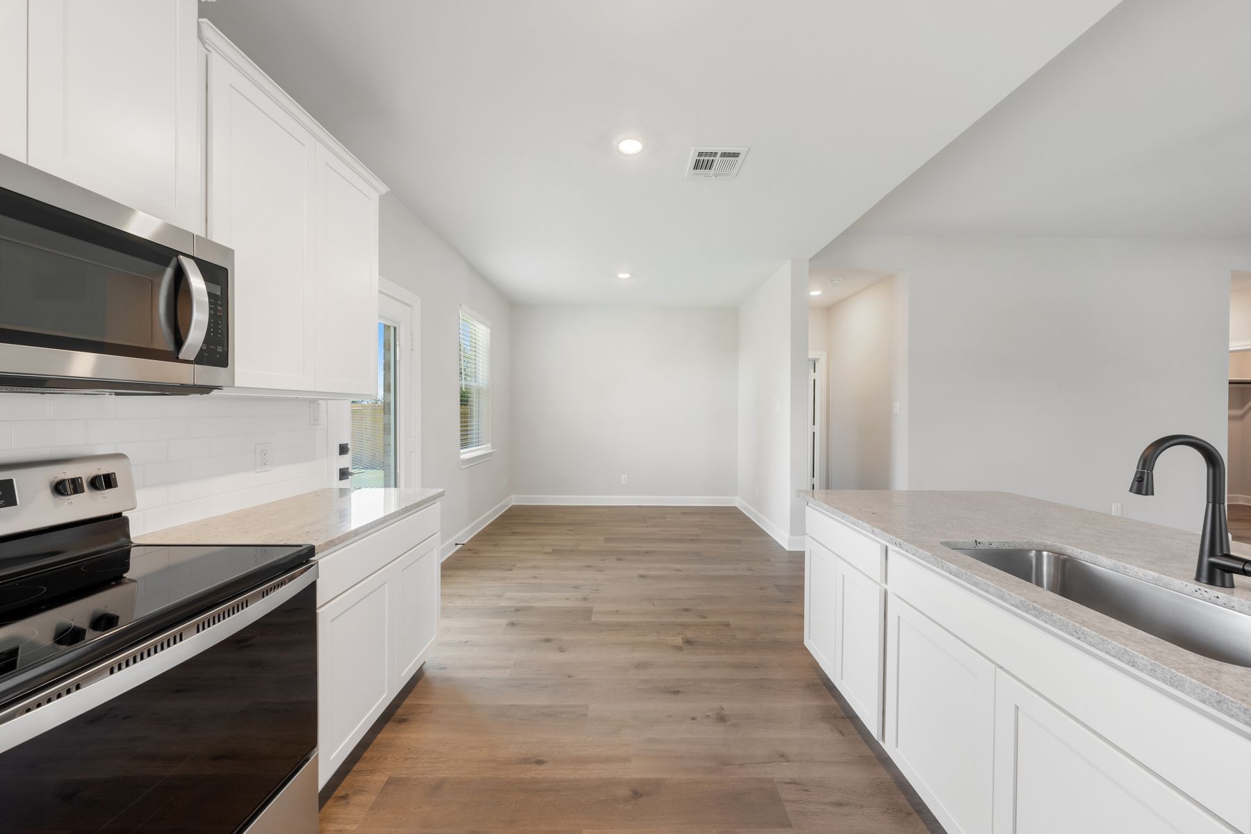 The dining room of the Reed floor plan sits right off of the kitchen.
