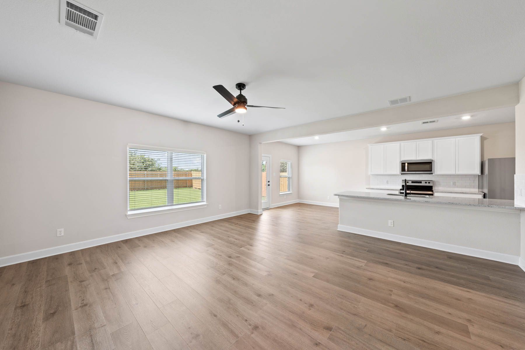 The Cypress has a wonderful open-concept layout with the kitchen, dining room and family room sitting next to each other.