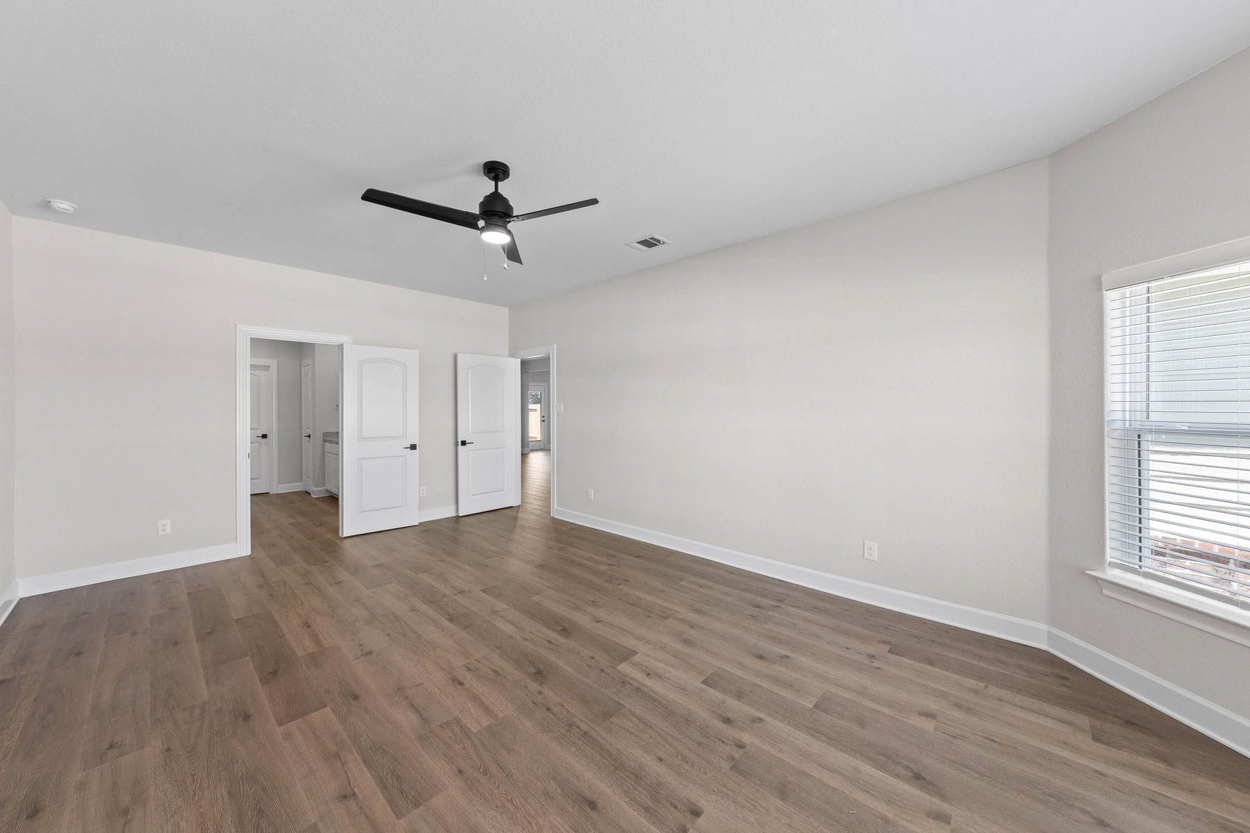 The master suite of the Cypress plan has a spacious bedroom, en-suite bathroom and walk-in closet.