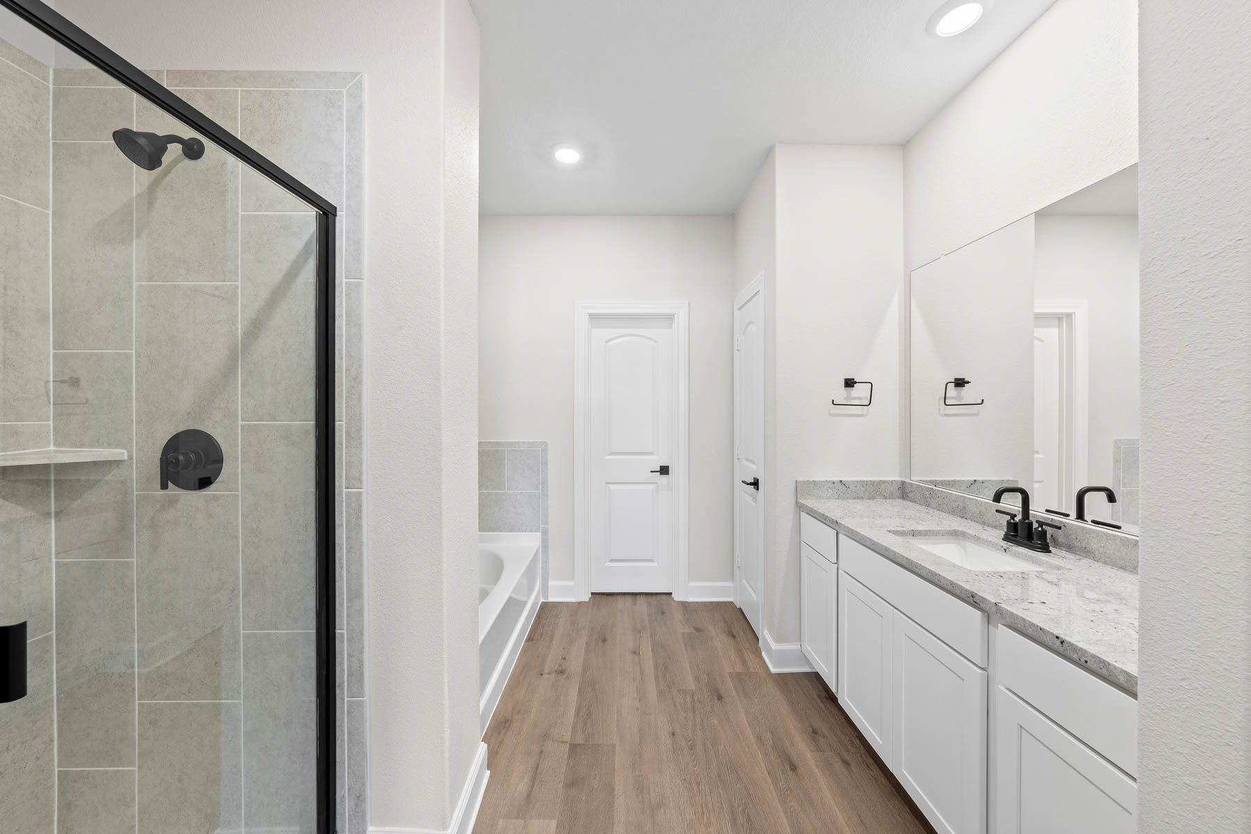 The master bathroom of the Cypress has a large walk-in shower and garden tub.