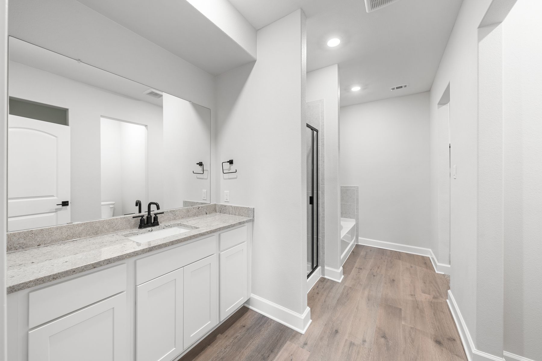 The master bathroom of the Driftwood has a large vanity space.