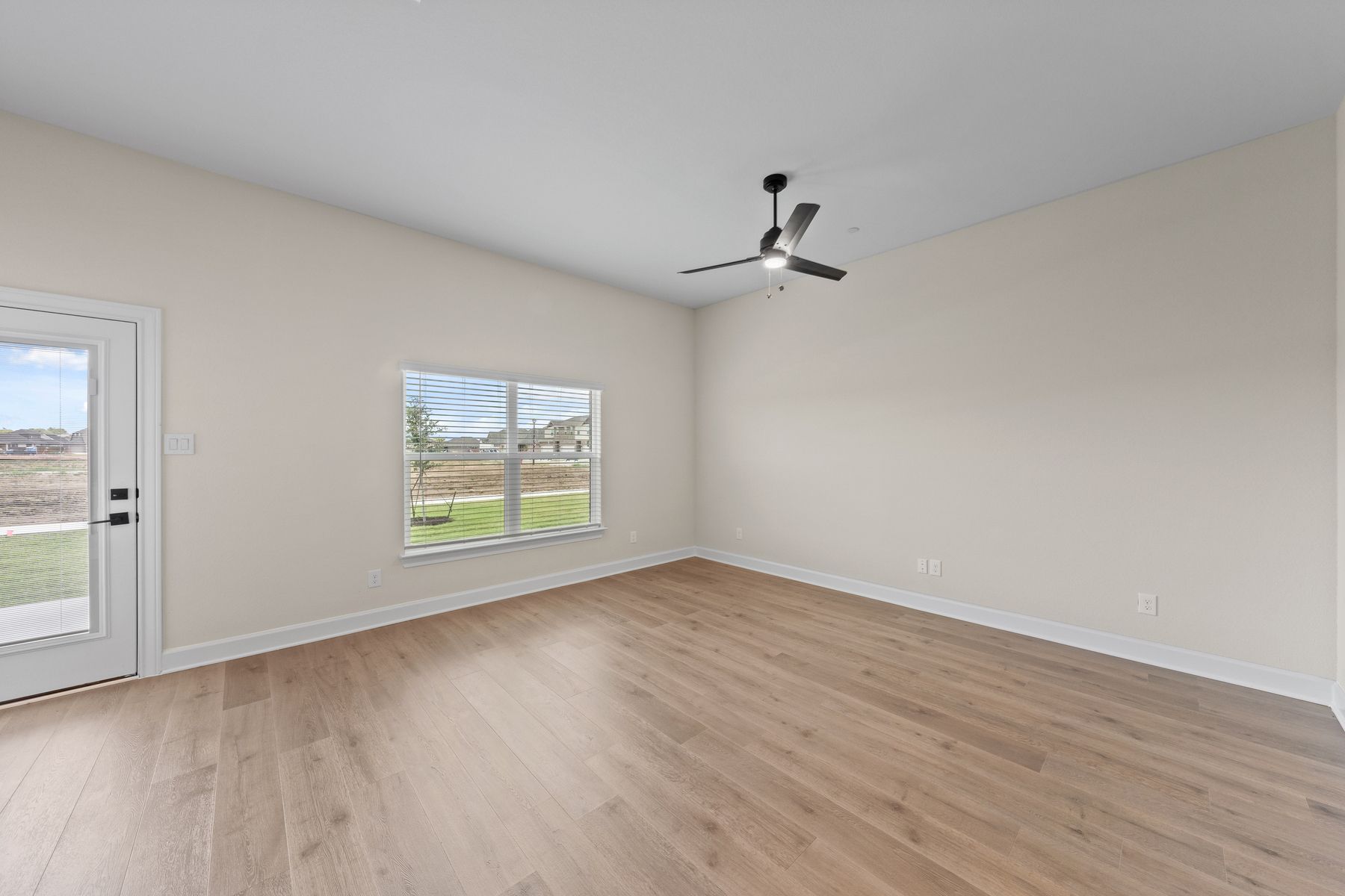 The family room has a large window that lets in great, natural light.