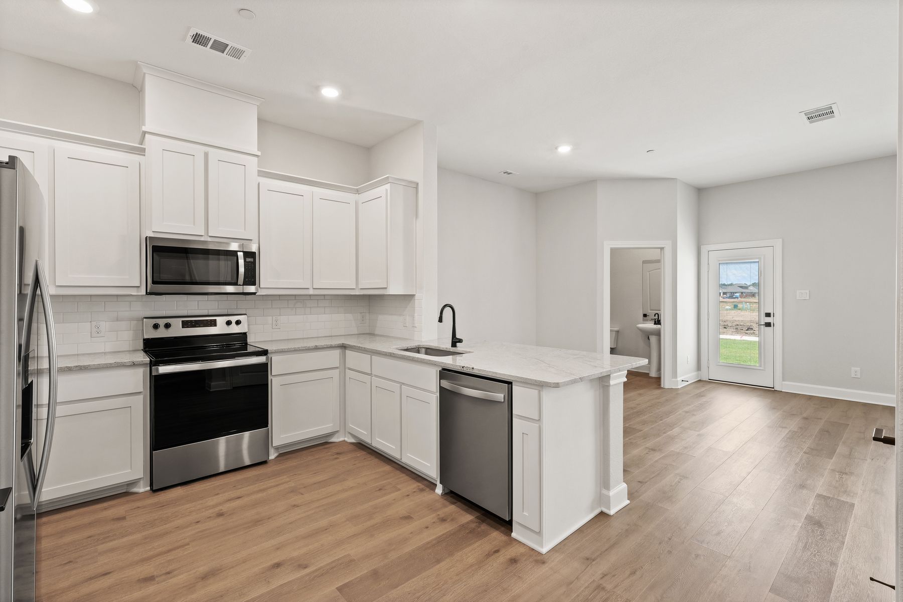 The kitchen of the Blazer has gorgeous white cabinetry.