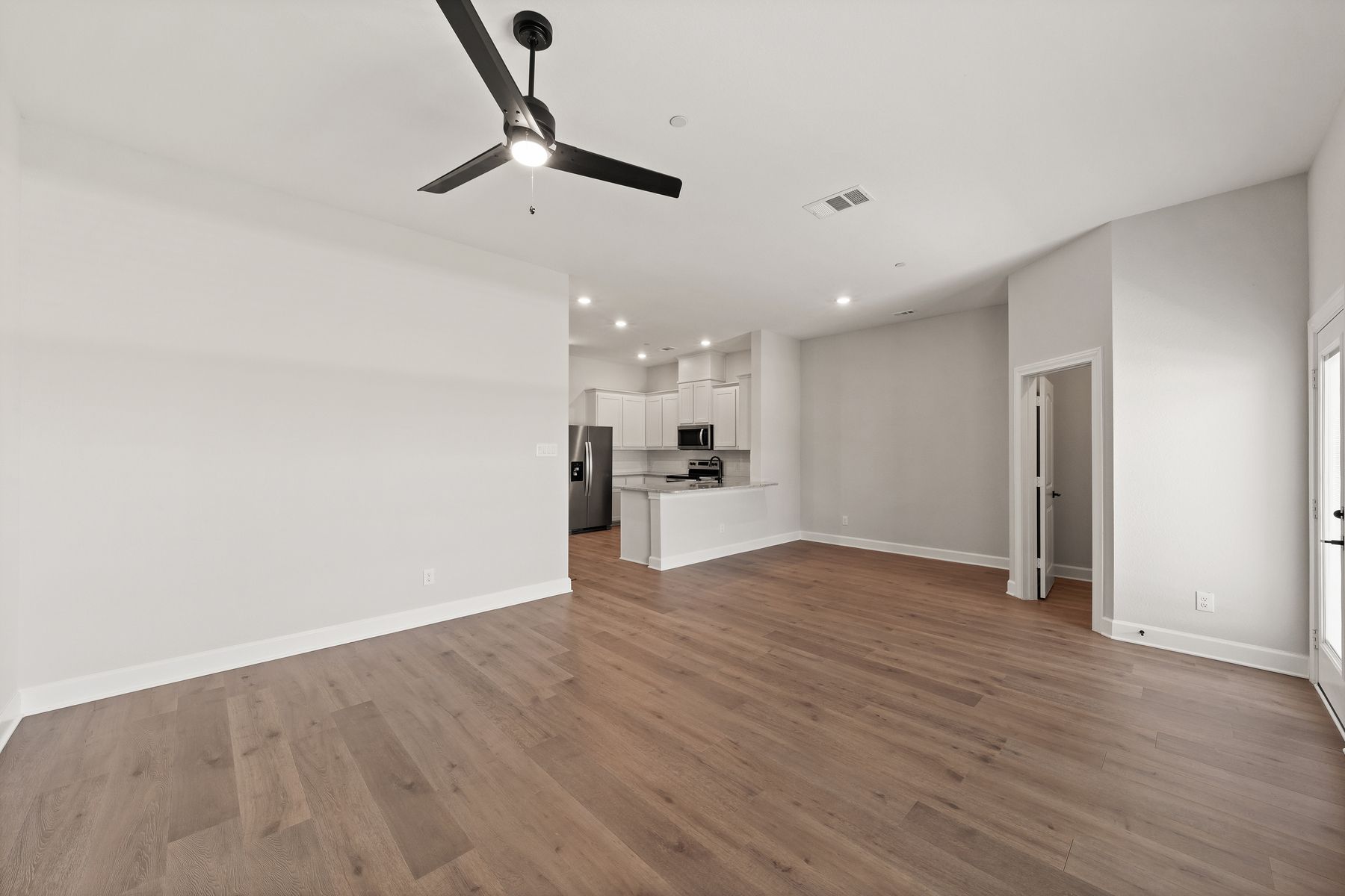 The family room has a large window that lets in great, natural light.