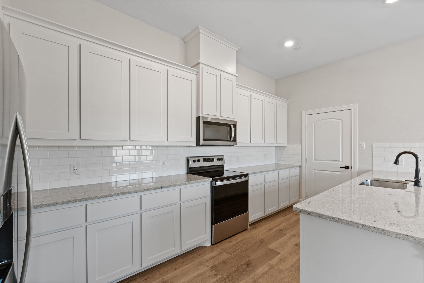 The Caspian has beautiful white kitchen cabinetry.