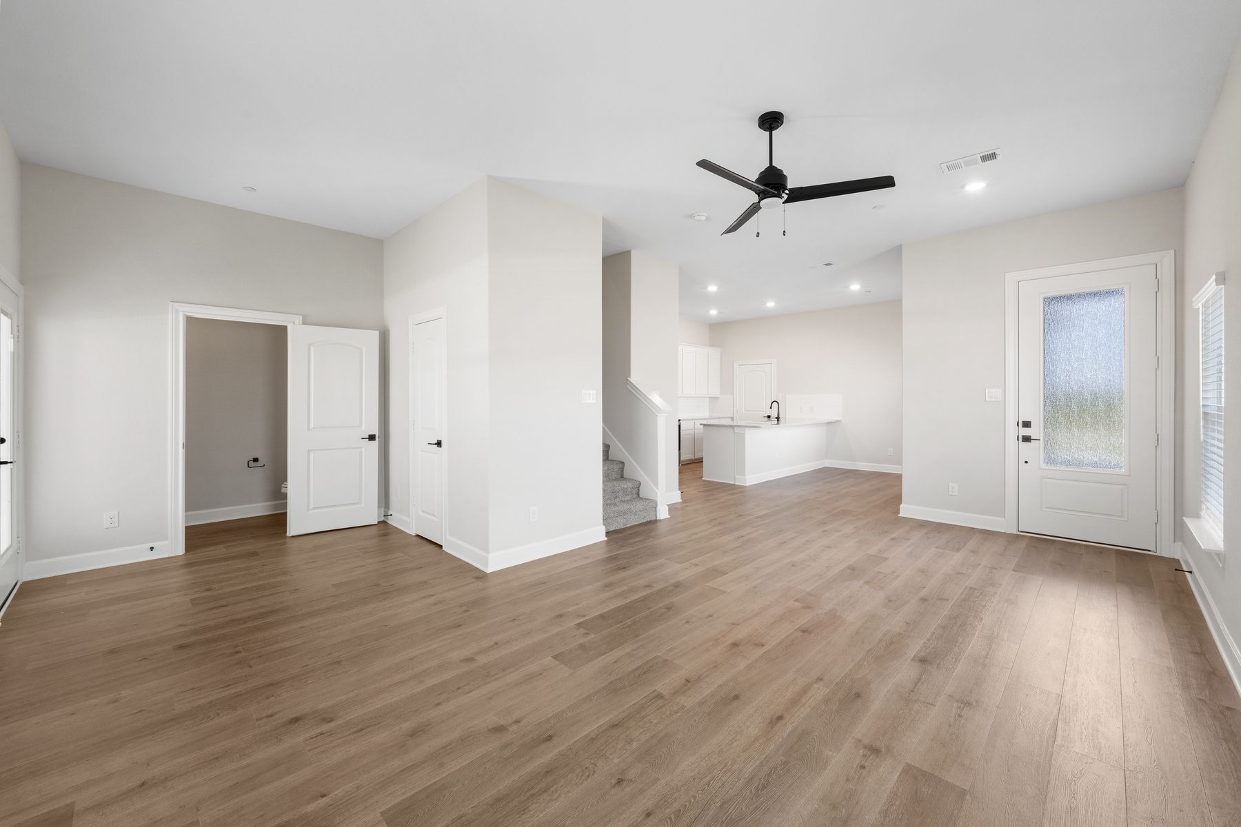 The open concept layout connects the kitchen, family room and dining area.