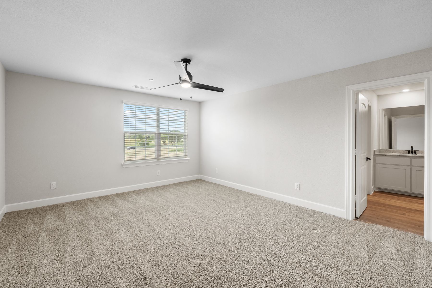 The master suite has a large bedroom, en-suite bathroom and giant walk-in closet.