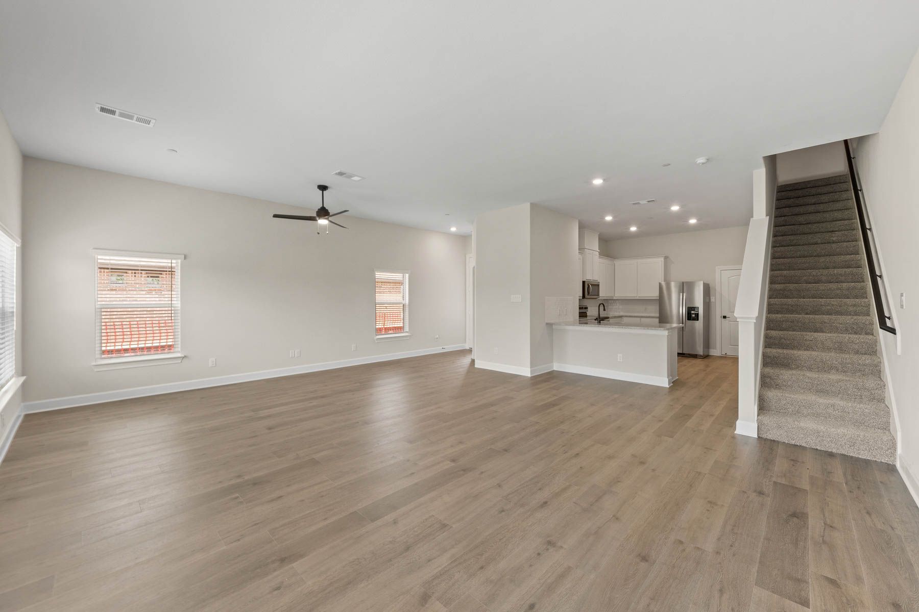 The downstairs of the Noma has an open-concept layout that connects the kitchen to the dining area and family room.