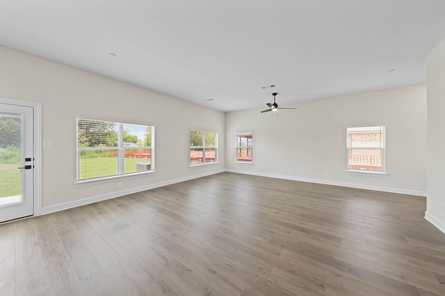 The downstairs of the Noma has large windows that let in great natural light and backyard views.