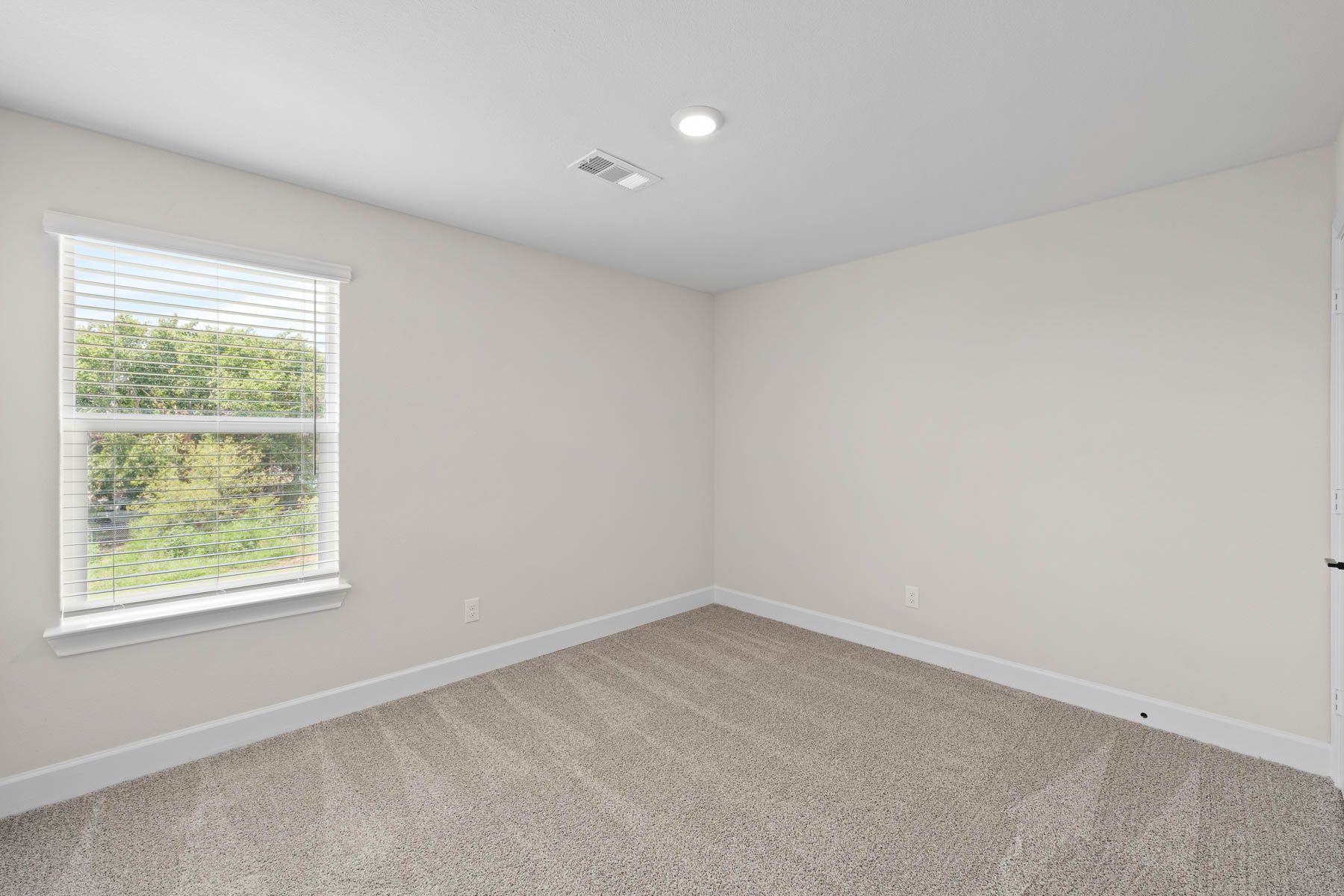 The secondary bedrooms of the Noma are the perfect space for a child's bedroom or a guest room.