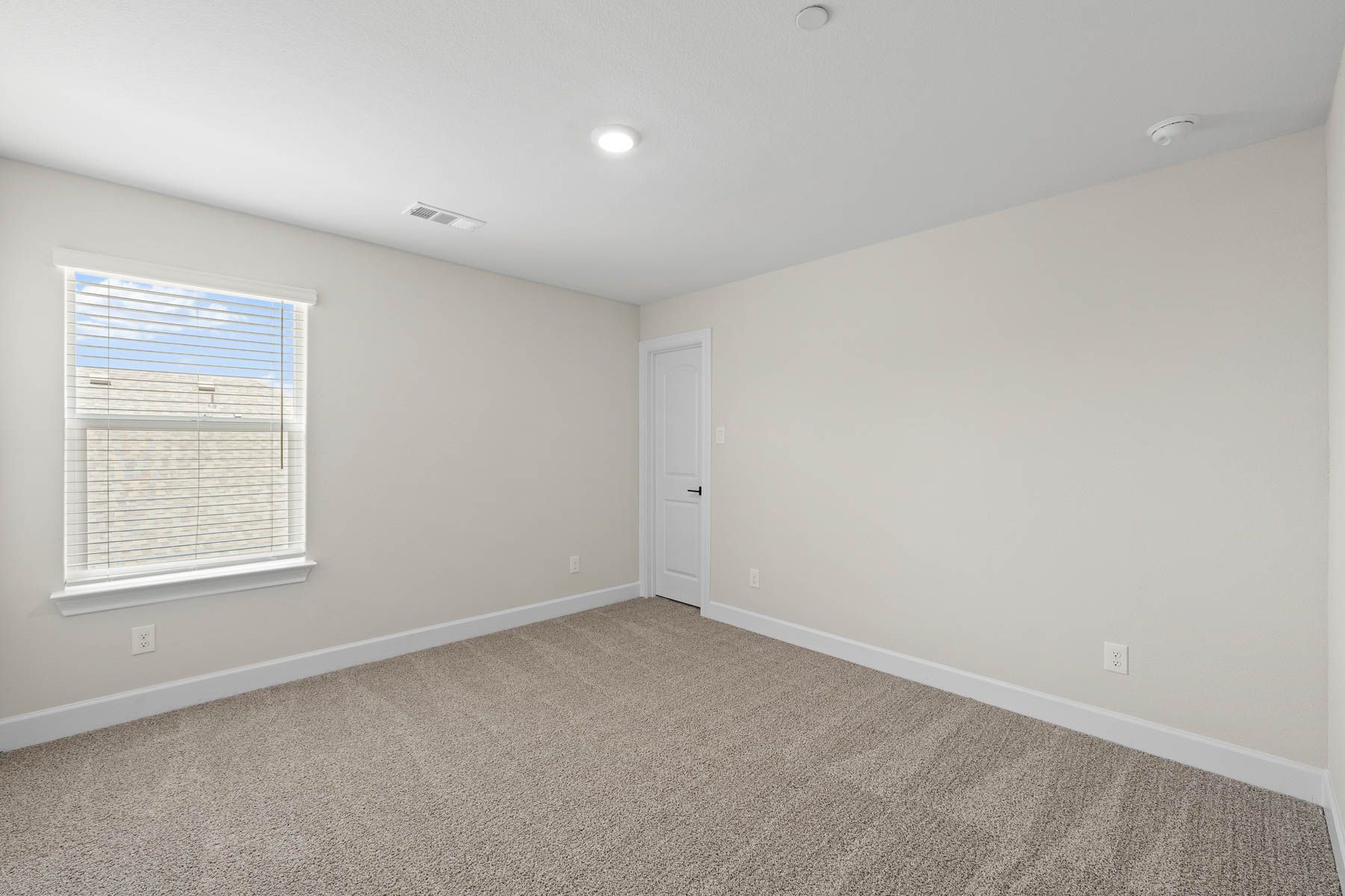 The secondary bedrooms of the Noma are the perfect space for a child's bedroom or a guest room.