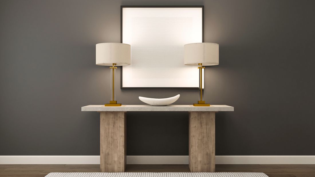 Rendering of foyer decorated with a table and decorative lamps.