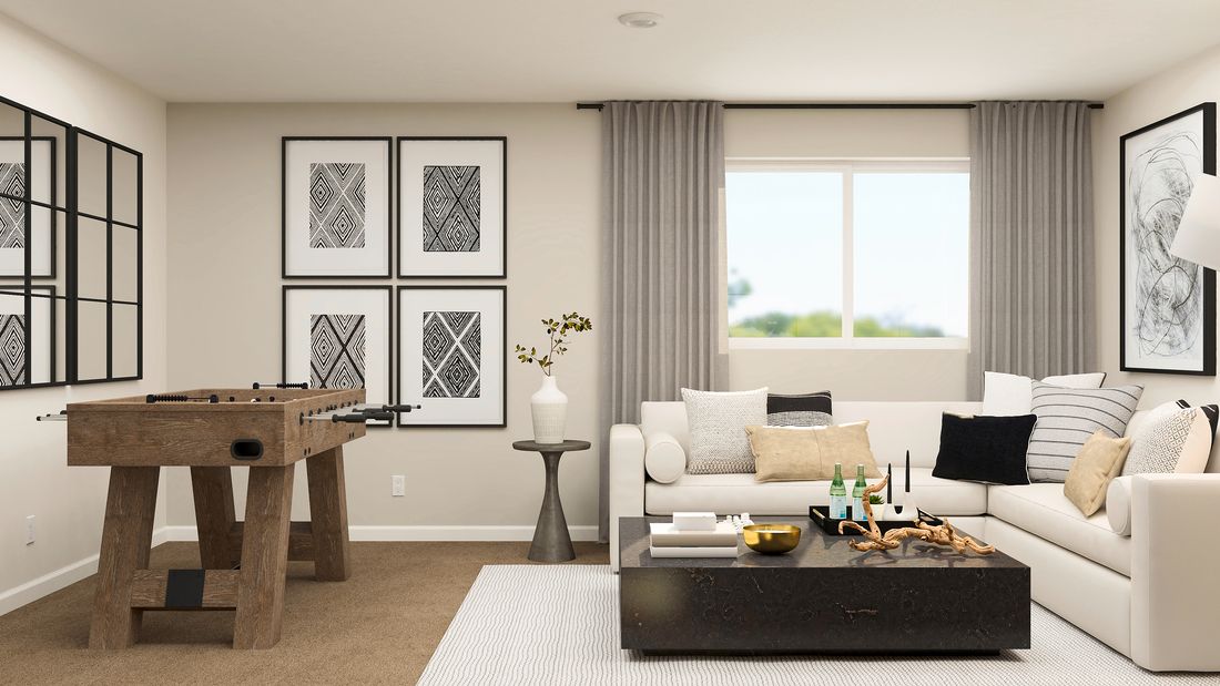 Rendering of the loft gameroom with a beautiful sectional and pool table.