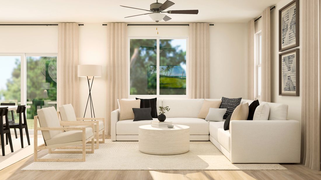 Rendering of the family room with a large white couch and beautiful chairs.