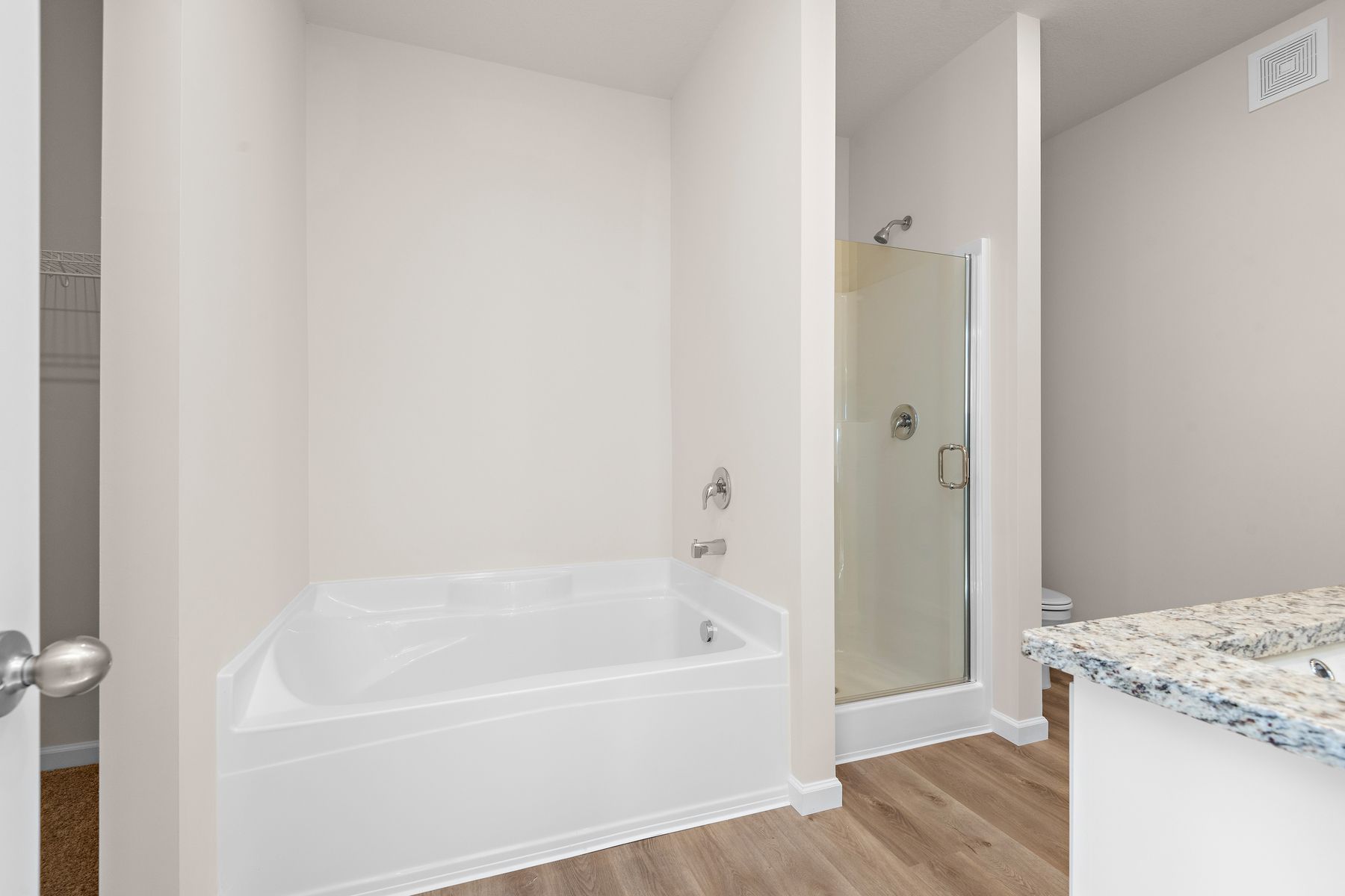 The master bathroom also has a soaking tub and step in shower.