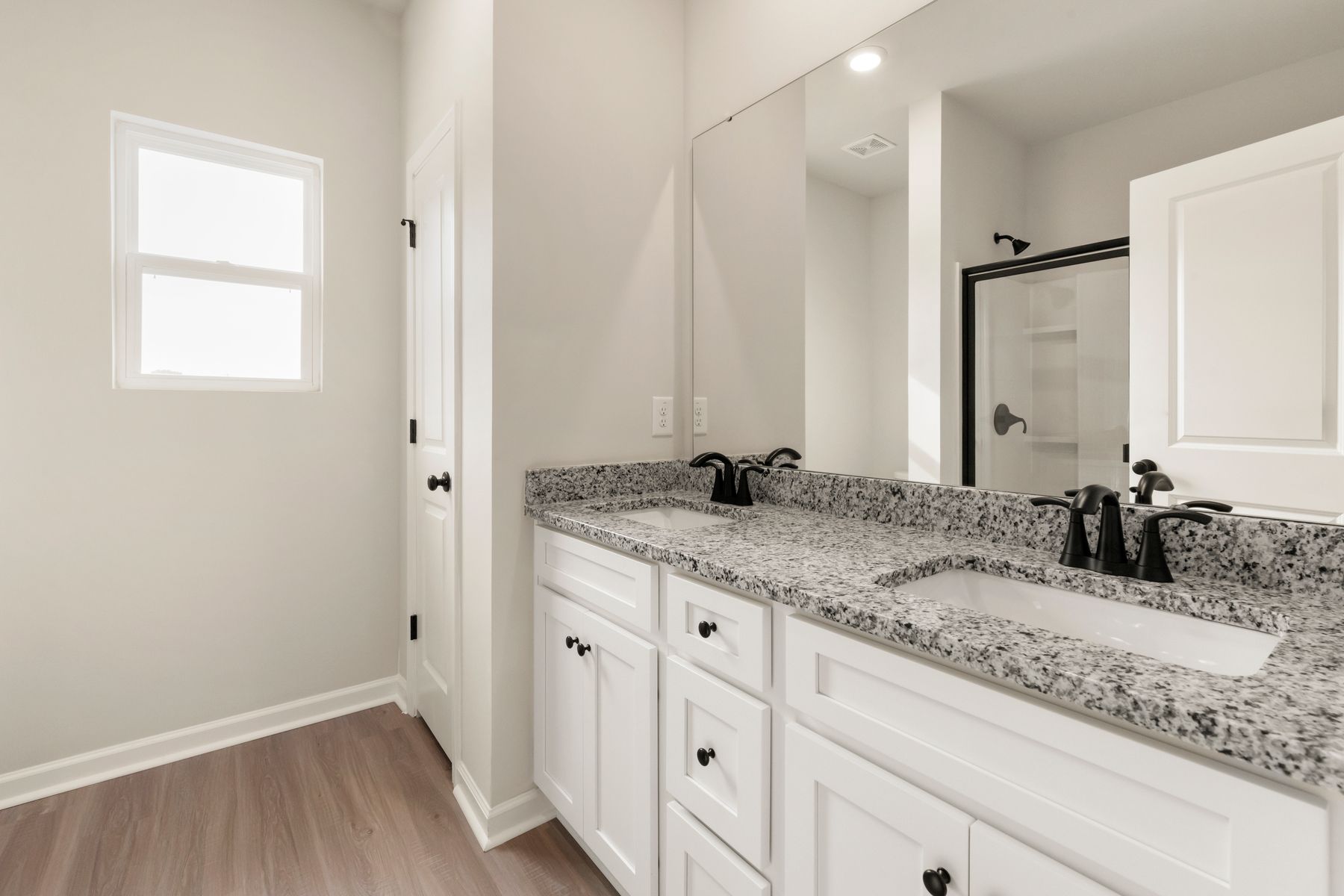 This bathroom has granite countertops