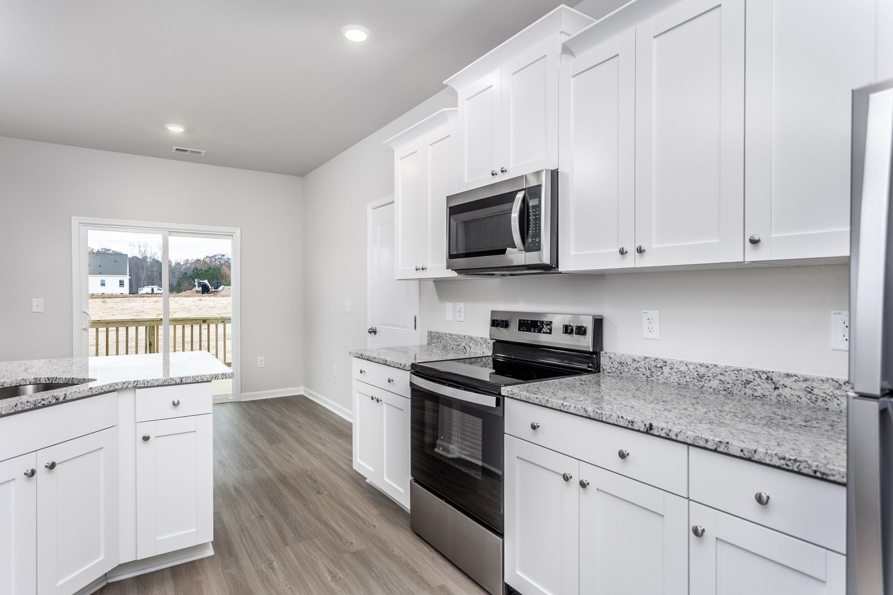 The kitchen has beautiful wood cabinetry