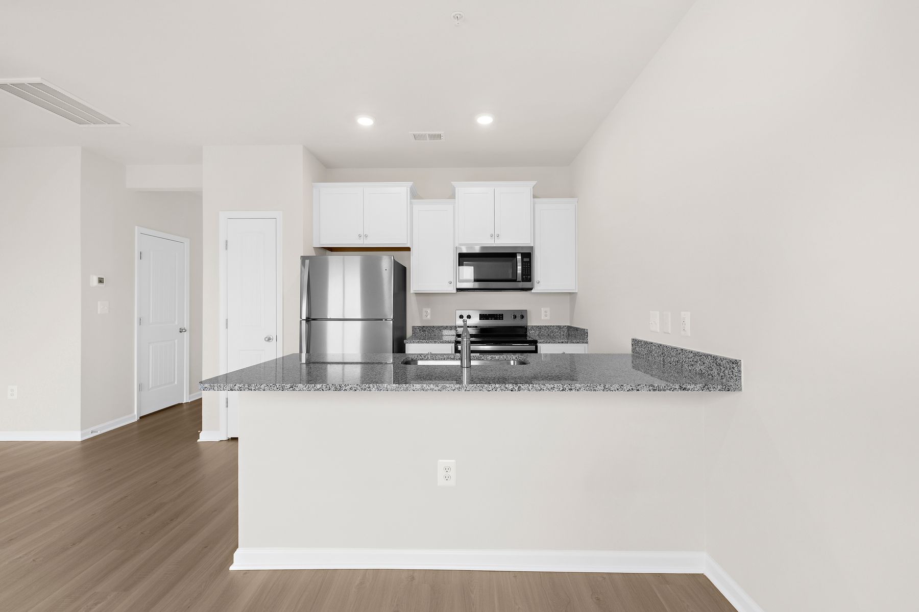 The Kitchen comes with stainless steel appliances