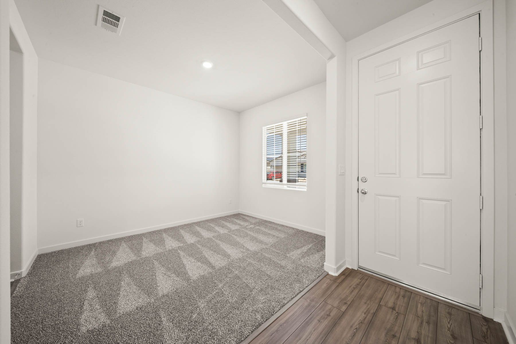 There is a flex room off the foyer.