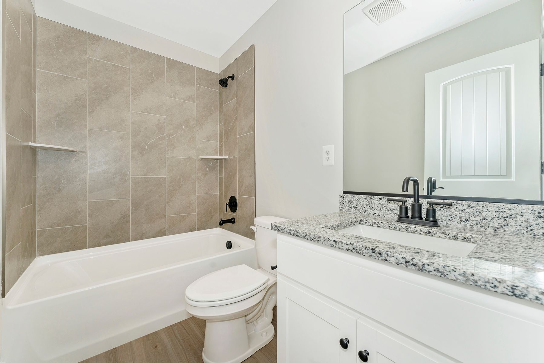 The secondary bathroom has a large soaking tub.