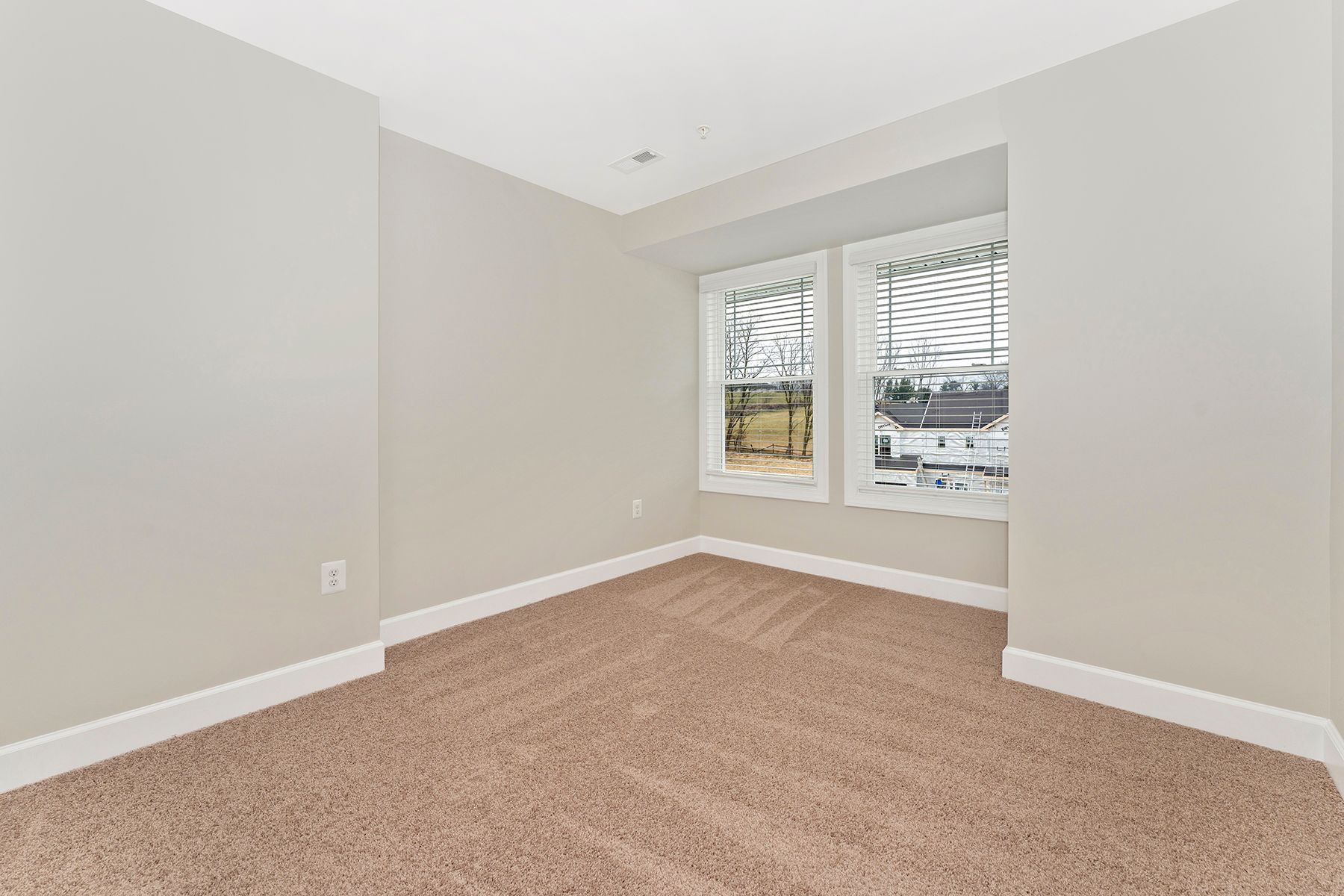 The secondary bedroom has its own walk-in closet.