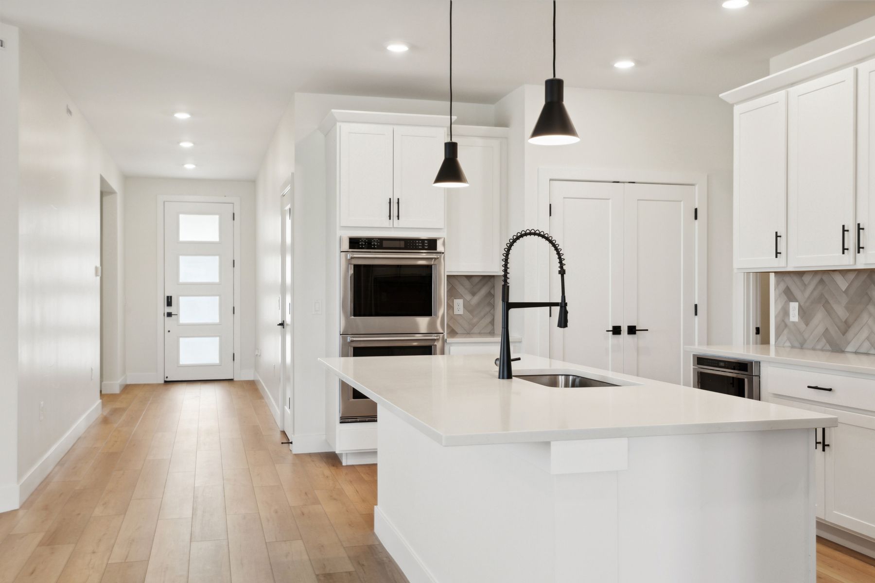 The foyer of the home opens up into the kitchen.