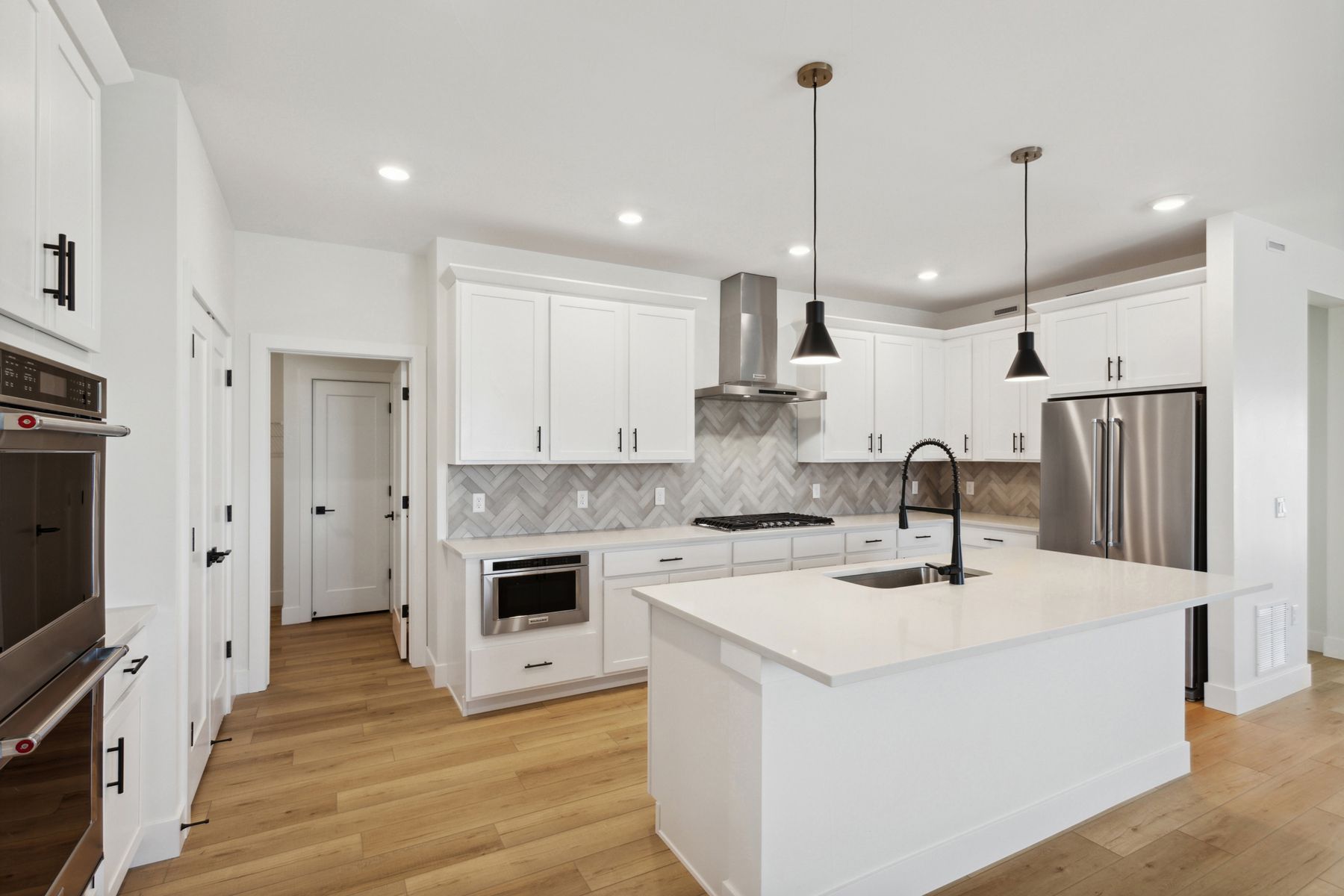 The kitchen has beautiful stunning tile backsplash.