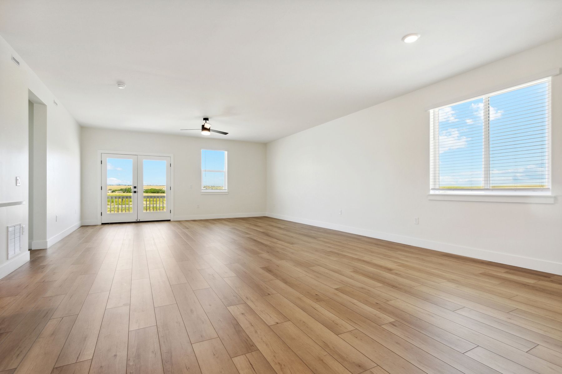 The family room has large windows that let in great, natural light.