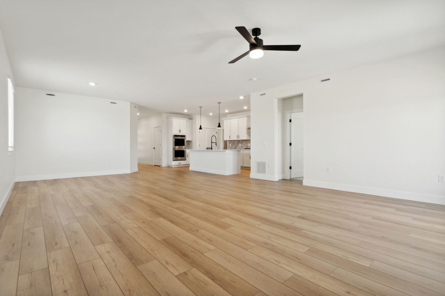 The family room is large and has plenty of room for furniture.
