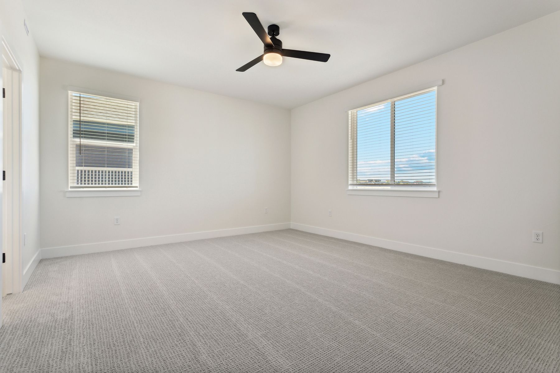 The master suite has a spacious bedroom, en-suite bathroom and walk-in closet.