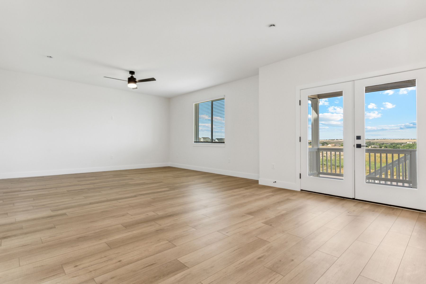 The large living room is open with lots of large windows that let in great, natural light.