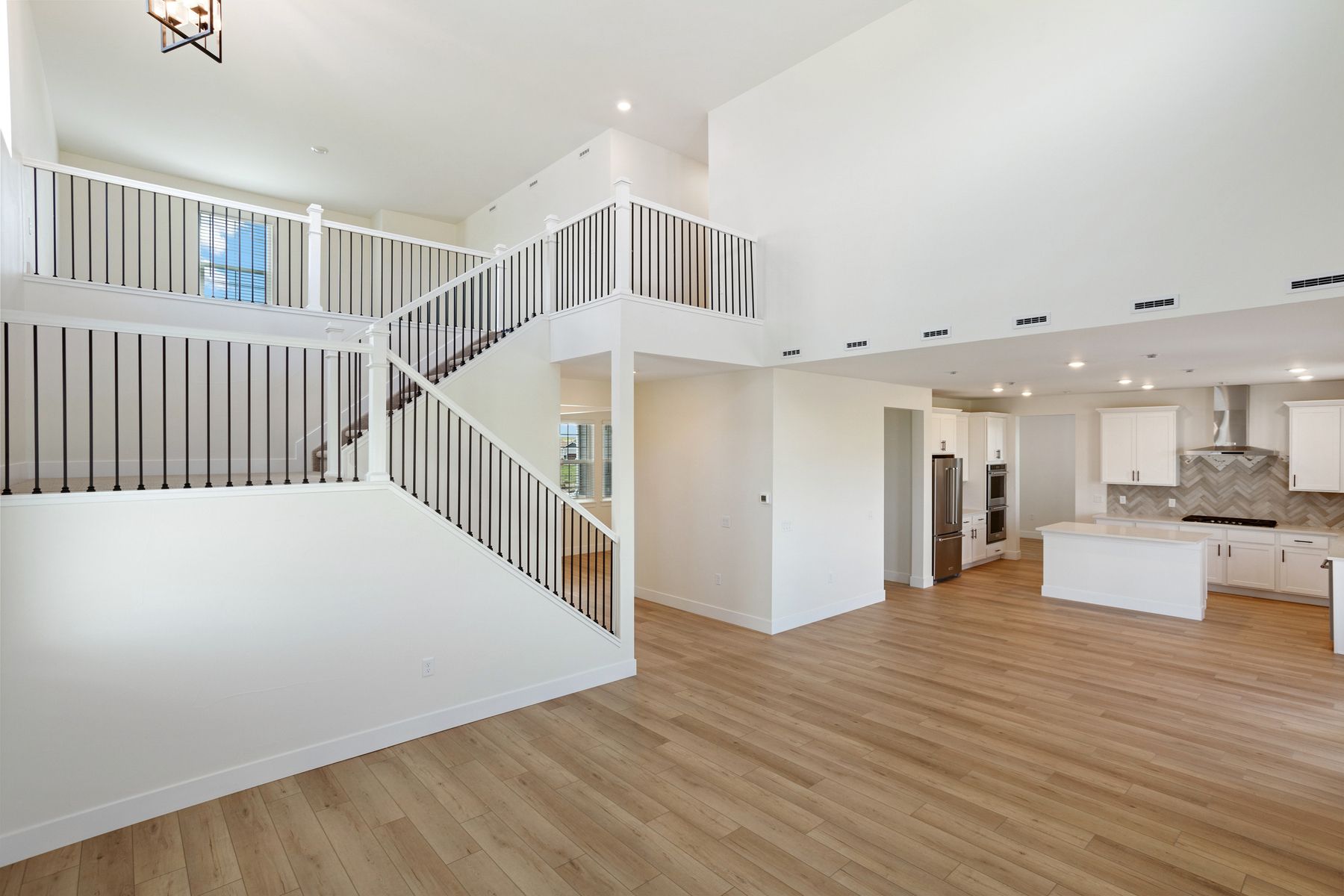 The open concept layout connects the living room and kitchen.