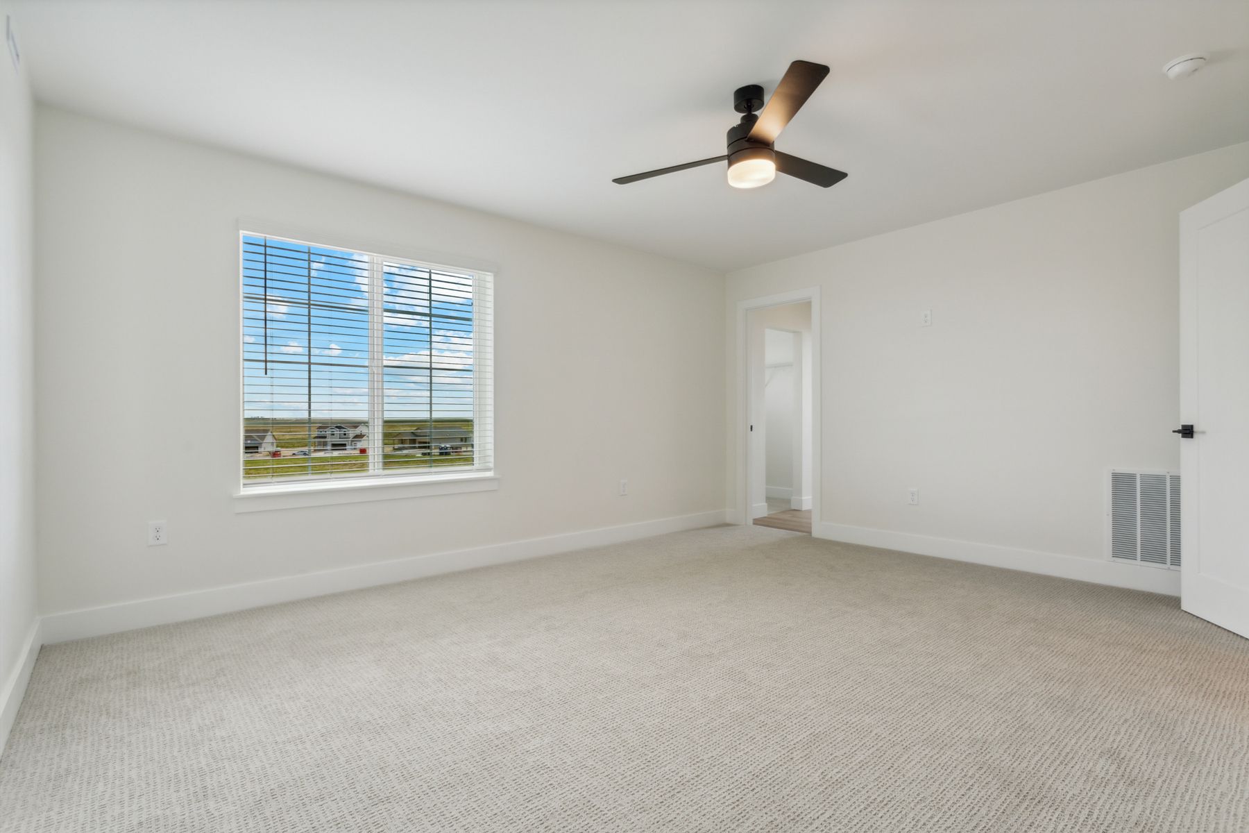 The master suite has a large bedroom, en-suite bathroom and walk-in closet.