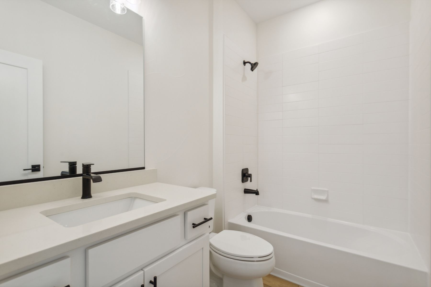 Both secondary bathrooms have a spacious vanity space and shower-tub combo.