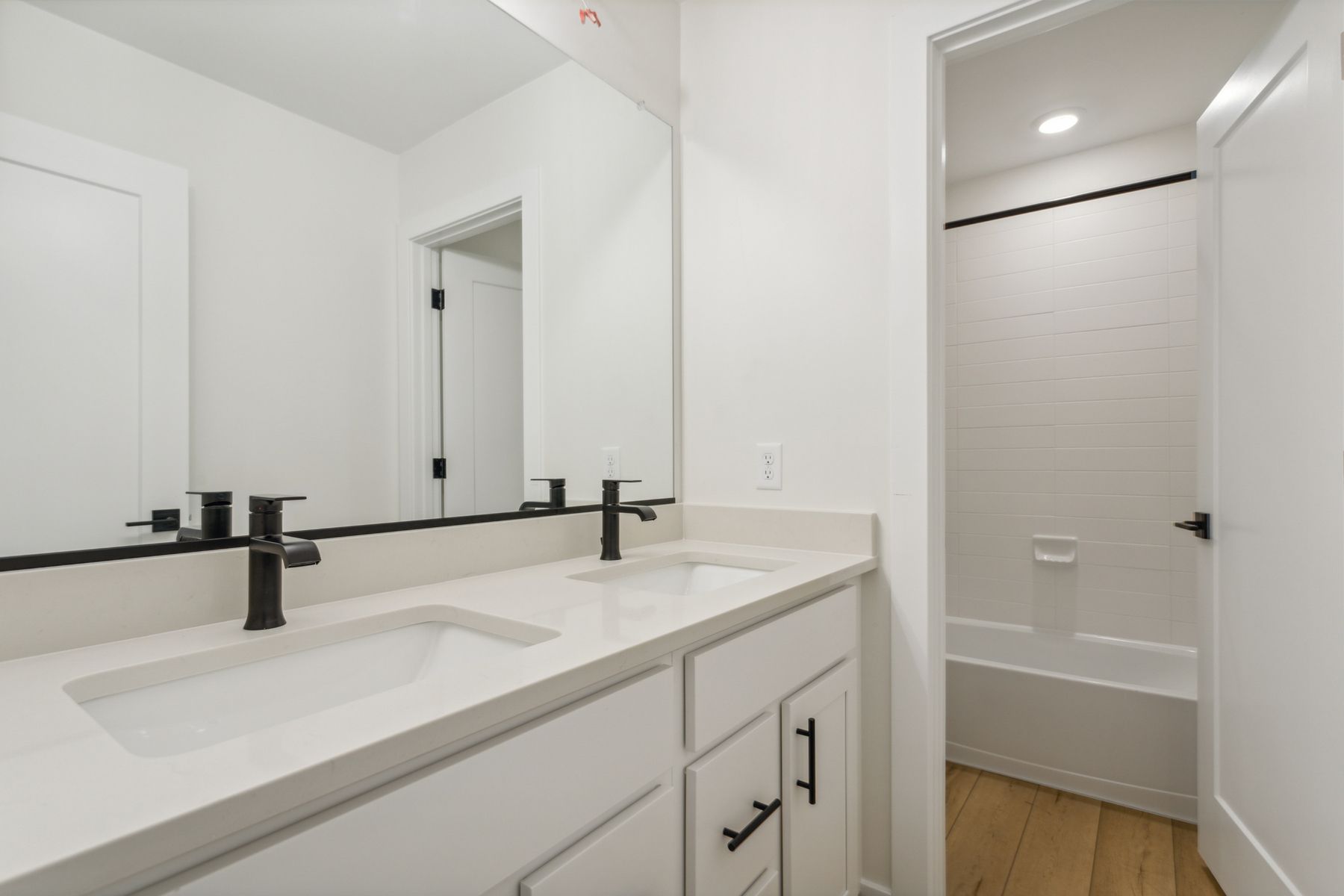 Both secondary bathrooms have a spacious vanity space and shower-tub combo.
