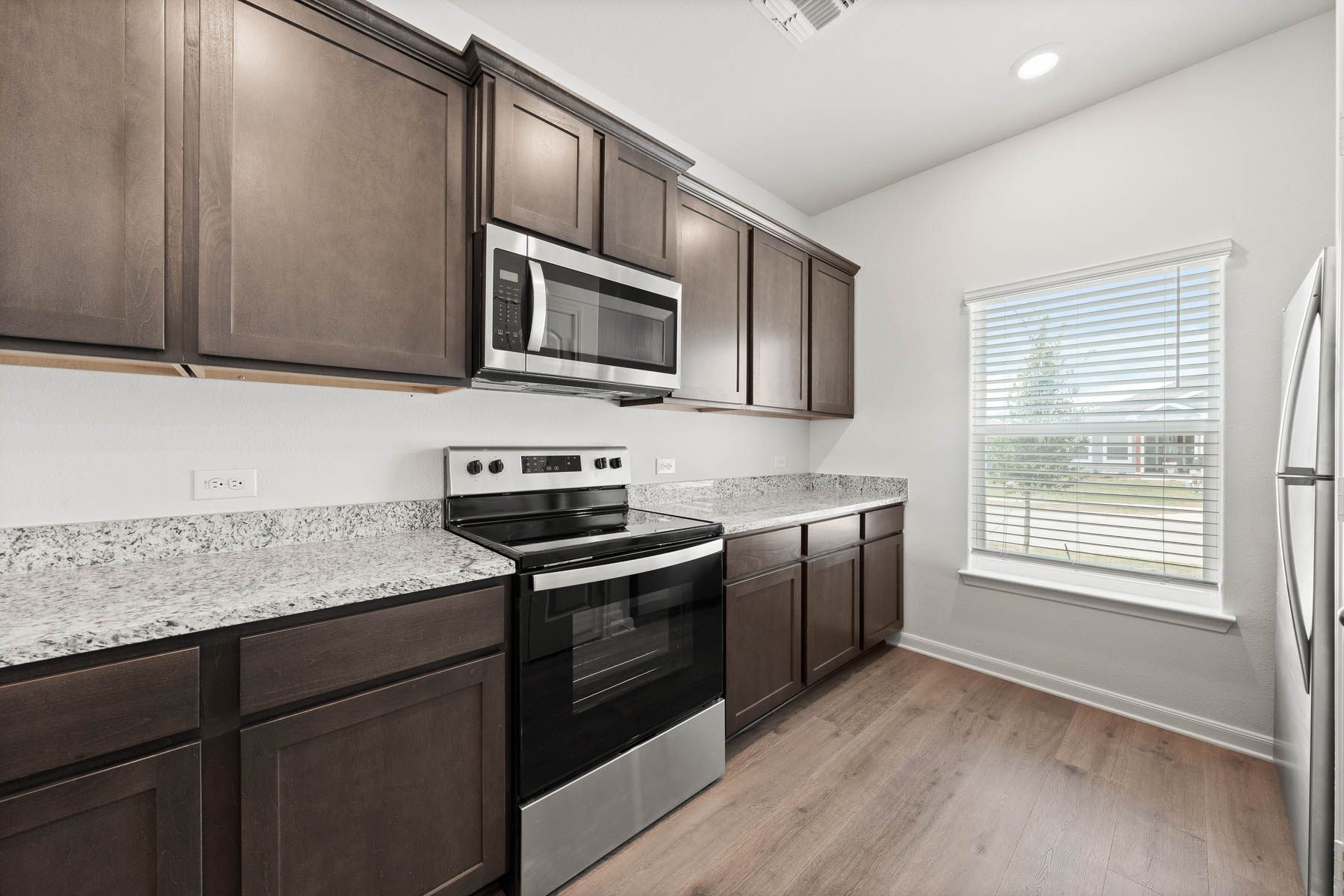 The kitchen of the Driftwood has beautiful wood cabinetry.