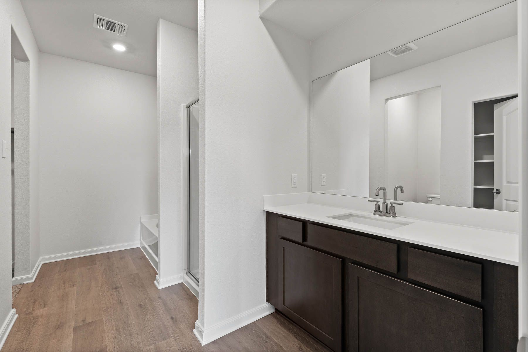 The master bathroom of the Driftwood plan has a large vanity space.